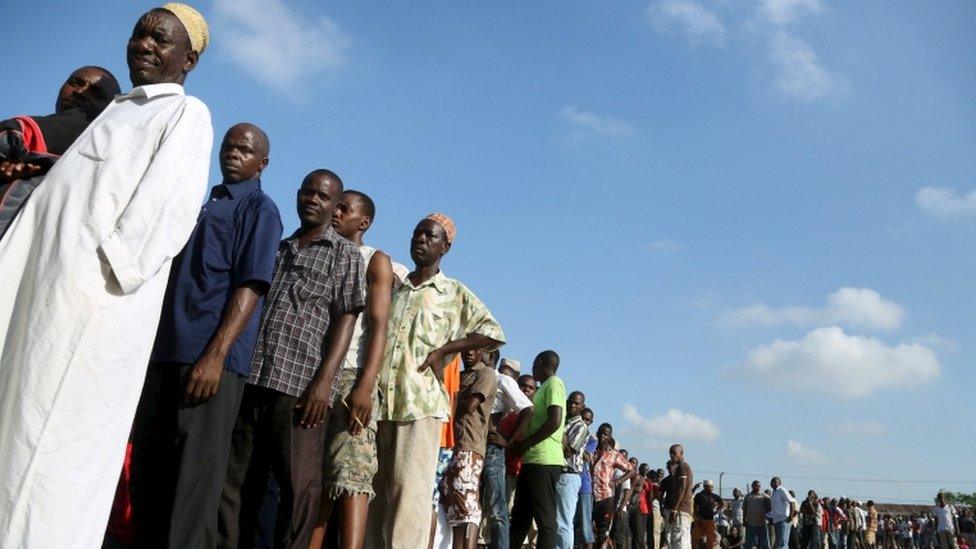 Voters queue outside a polling station during the presidential and parliamentary election in Ubungo ward in the Kinondoni district of Dar es Salaam, October 25, 2015. Tanzanians voted on Sunday in presidential and parliamentary polls in which the ruling party is expected to fend off rivals led by former Prime Minister Edward Lowassa, who has tapped into mounting anger over corruption and the slow pace of change.