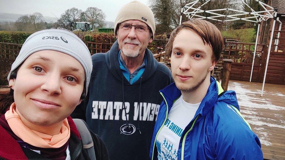 Rory (right) with their dad and partner