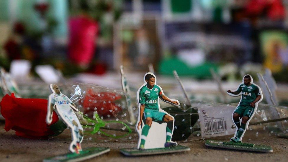 Fans pay tribute to the players of Brazilian team Chapecoense Real at the club's Arena Conda stadium in Chapeco