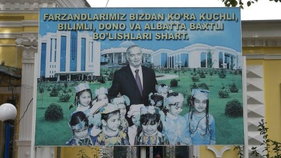 A huge poster shows Uzbek President Islam Karimov posing with a group of children and the words reading "Our children ought to be stronger and smarter than us and they ought to be happy!" (29 August 2016)