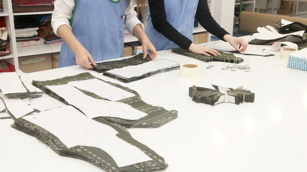 Women working to manufacture clothes in a factory