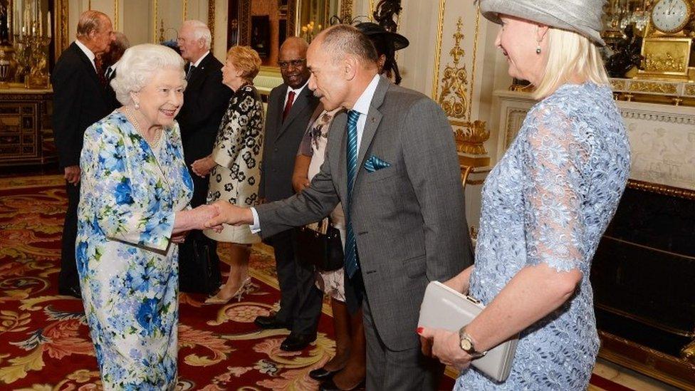 Queen Elizabeth II (R) shakes hands with New Zealand"s Governor-General Jerry Mateparae (2R) during a reception ahead of the Governor General's lunch in honour