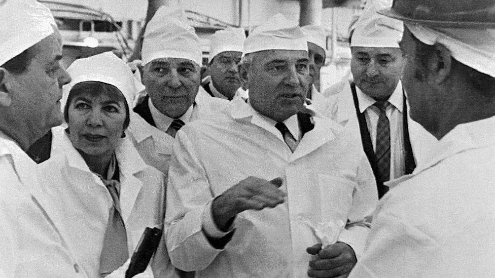 Soviet leader Mikhail Gorbachev (3rd from right) and his wife Raisa Gorbacheva (2nd from left) talk with officials of the Chernobyl nuclear power plant on 23 February 1989 during the Soviet leader's first visit to the plant following the April 1986 disaster