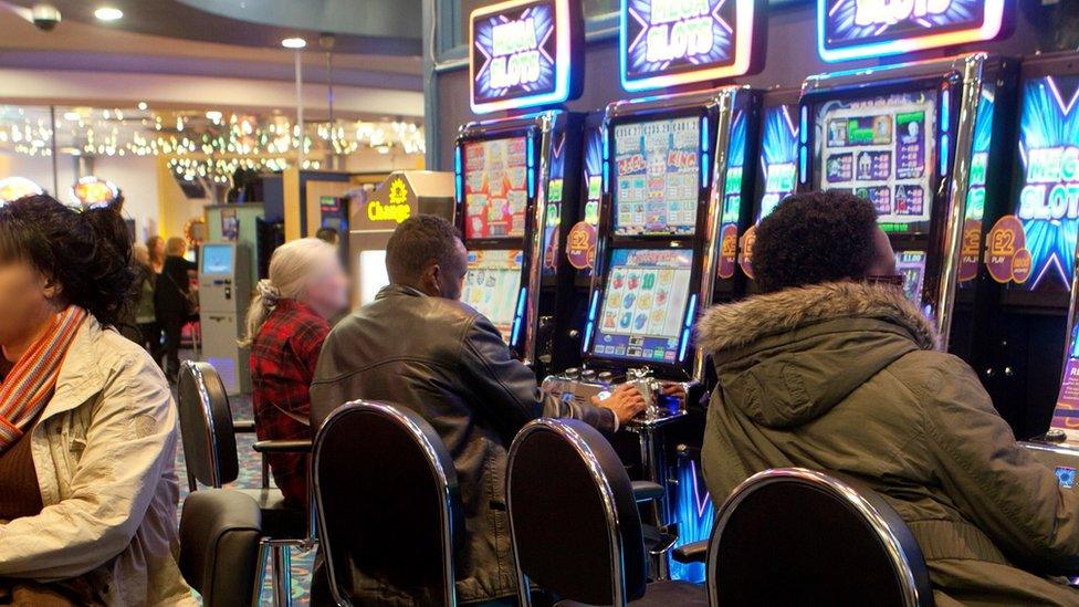 People playing on the gambling machines