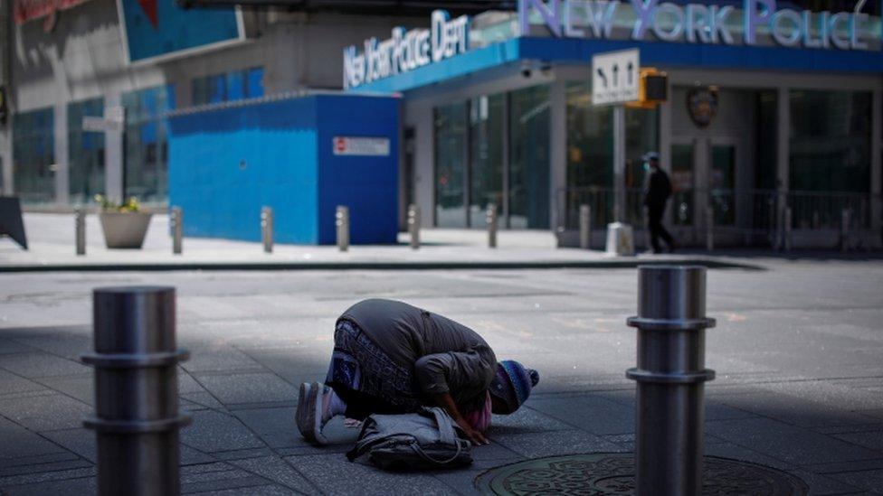 Muslim woman prays in Times Square - 7 April