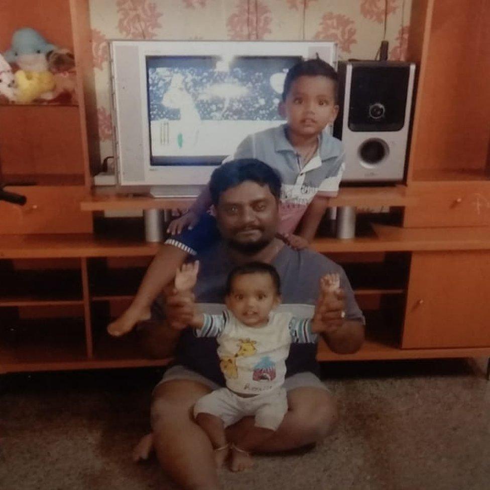 Rajesh with his two sons at home in Bangalore