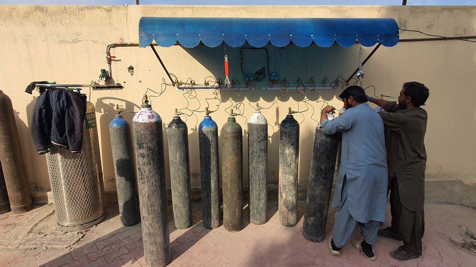 Oxygen bottles outside a hospital