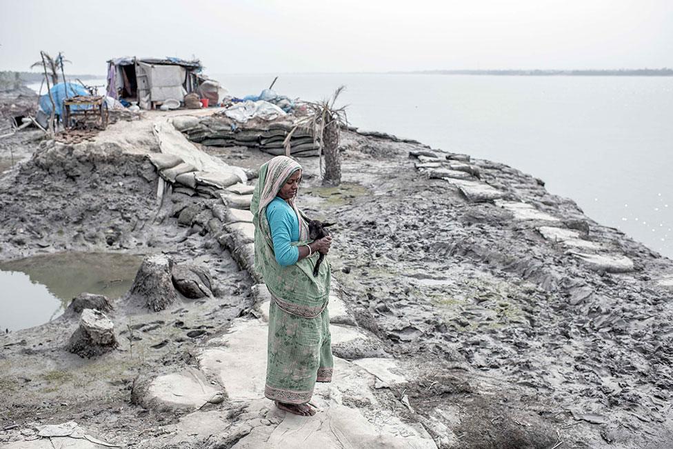 A woman stands in the Sundarbans in Bangladesh