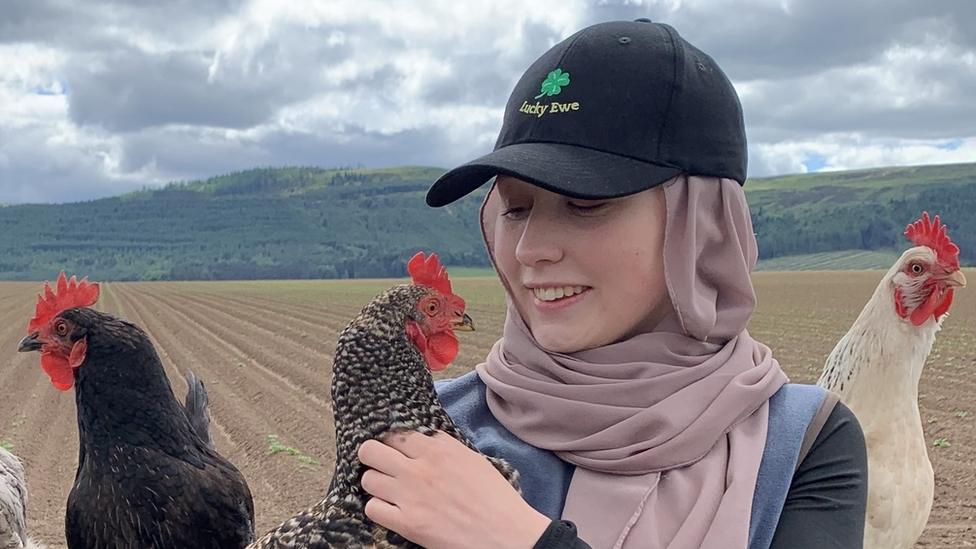 Abby-Leigh and three of her chickens