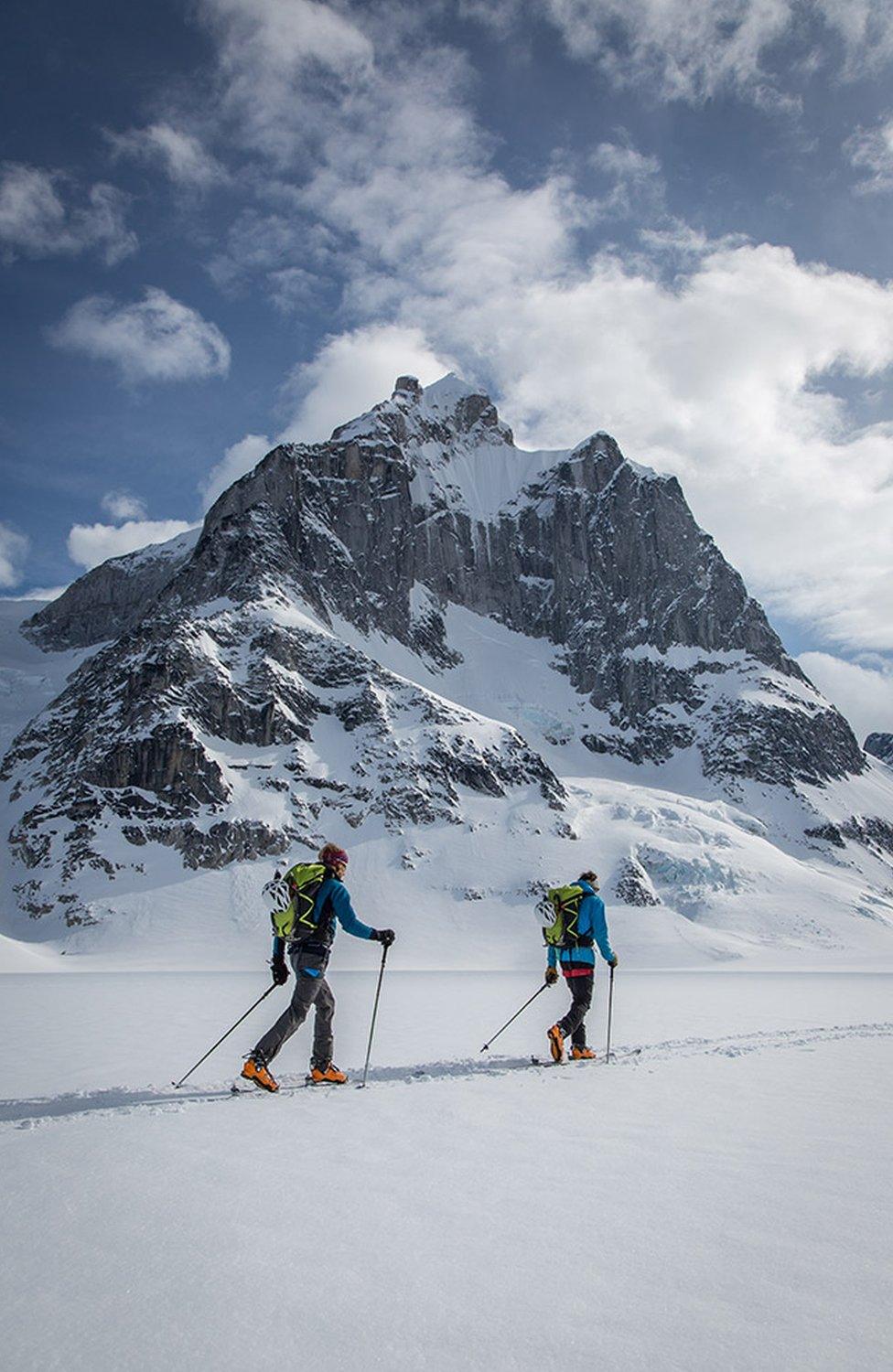 Matt Helliker, left, and Jon Bracey on skis with the Citadel in the background