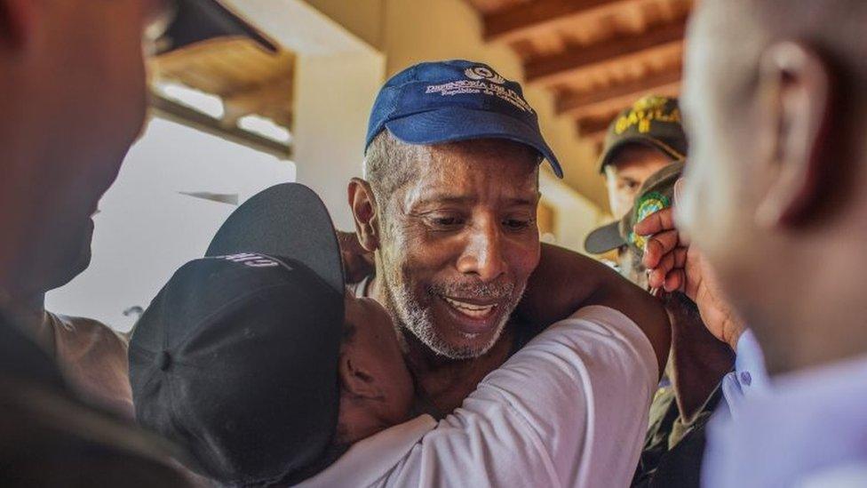 Odin Sanchez, a former lawmaker held captive since April 2016 by the ELN, greets his relatives after being released in Quibdo, Choco department in western Colombia on February 2, 2017