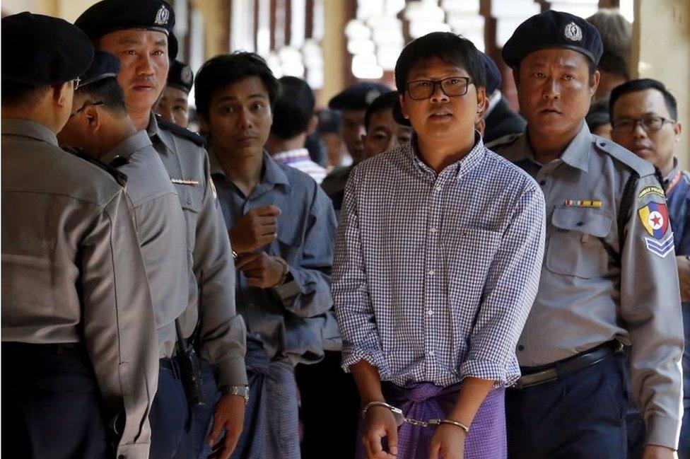 Detained Reuters journalist Wa Lone (2-R) and Kyaw Soe Oo (2-L) are escorted by police as they leave the court after the hearing in Yangon, Myanmar, 01 February 2018.