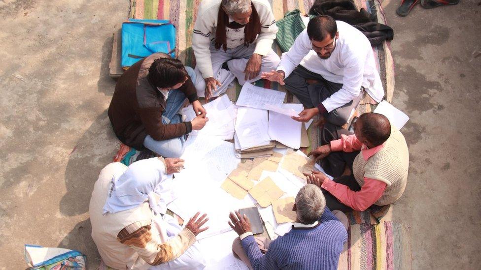 Mr Yadav speaking to villagers about RTI