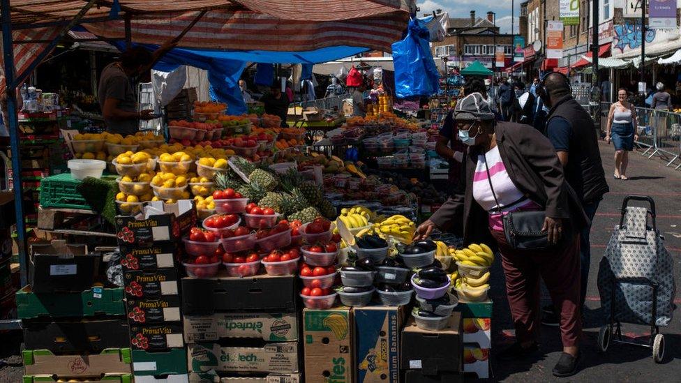 People shop at Ridley Road market in Dalston