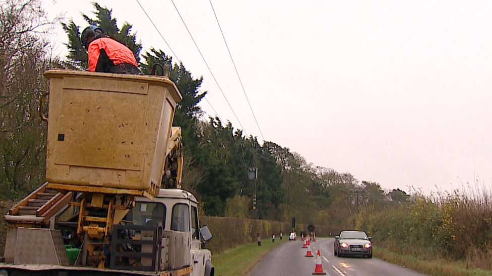 Road cones laid out to protect verge cutter