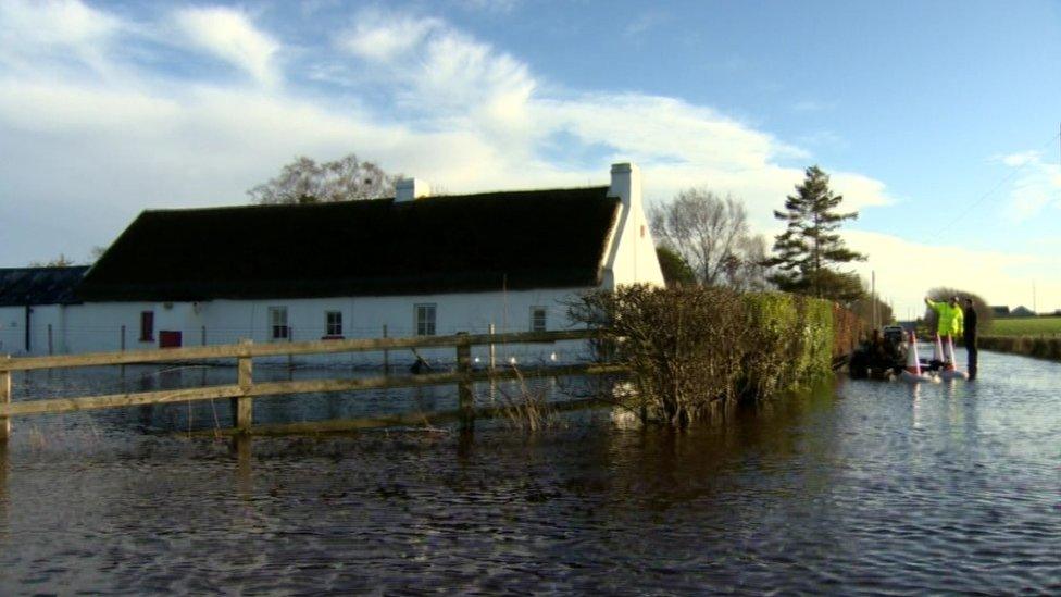 A 300-year-old listed cottage is surrounded by floodwater