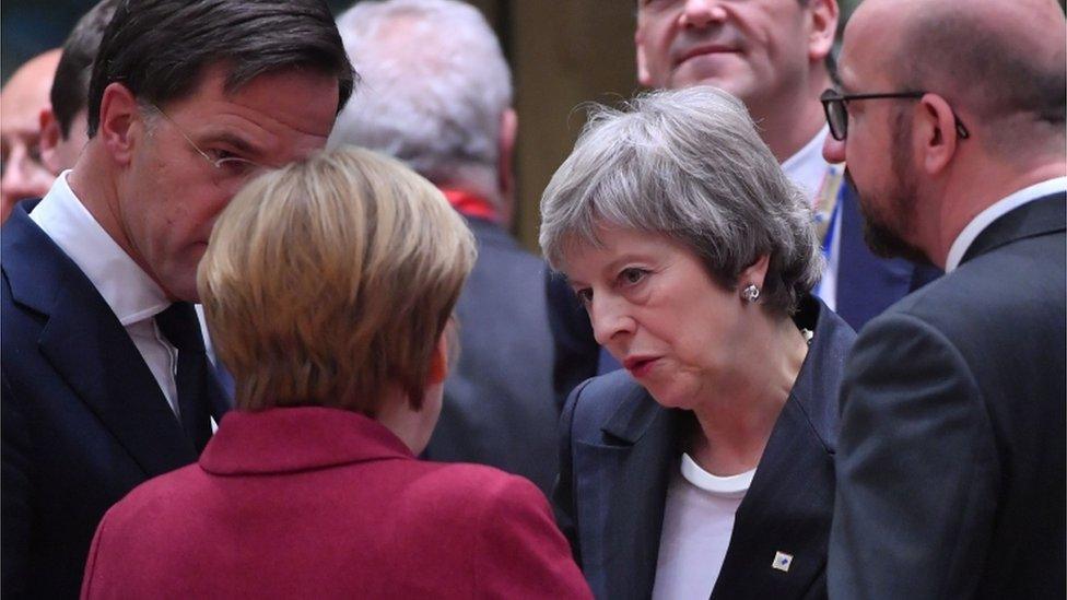 Theresa May talks with EU leaders at the summit