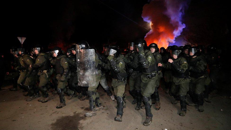 Police officers clearing the road