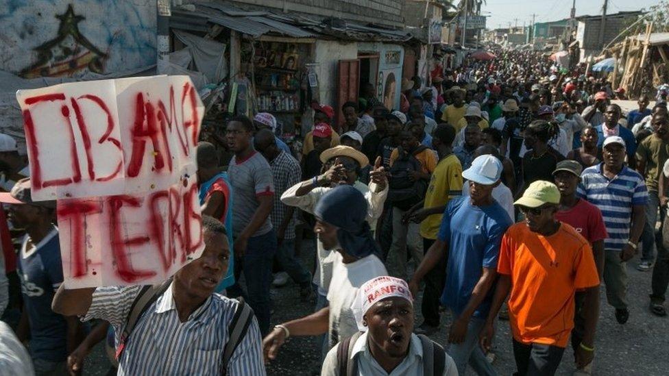 Demonstrators attend a protest called by the Haitian opposition to demand that authorities postpone the second round of the presidential elections, in Port-Au-Prince, Haiti, 19 January 2016.