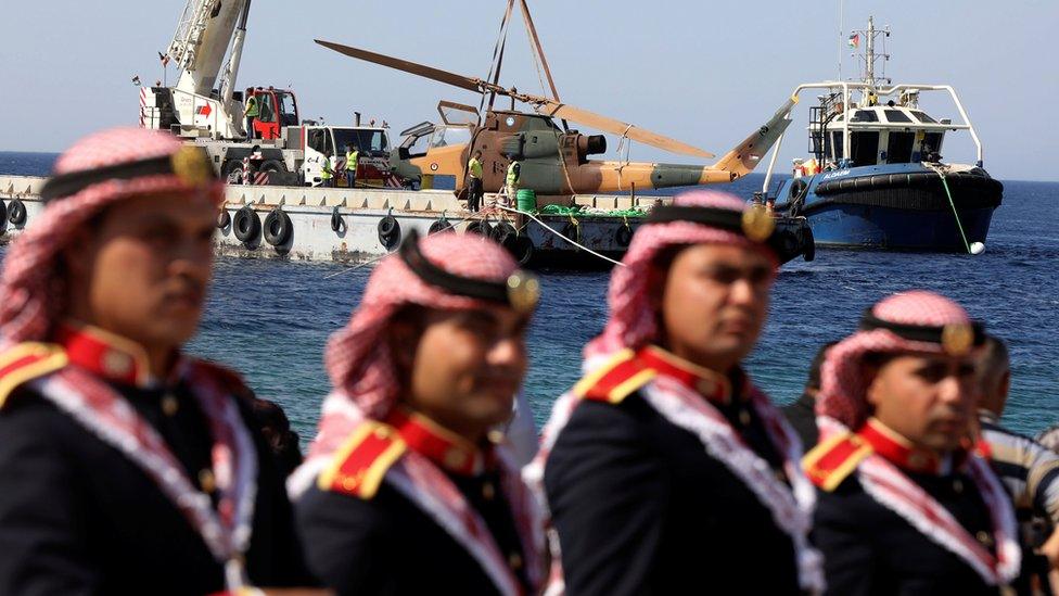 A body of a military helicopter, donated by the Jordanian Royal Air Force, is prepared to be submerged in the Red Sea off Aqaba