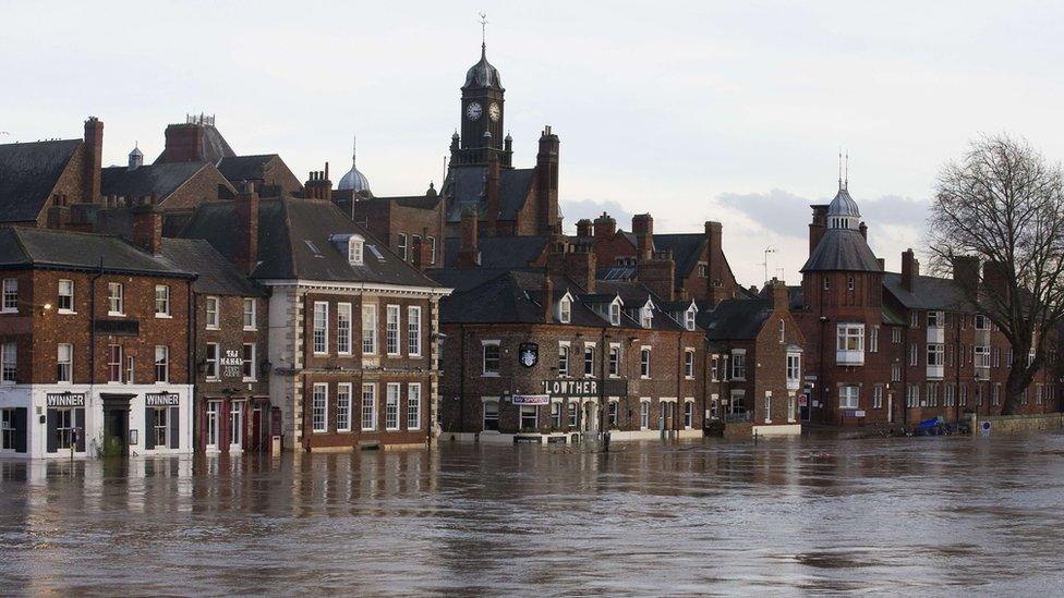 Floodwater surrounding buildings near the River Ouse in York