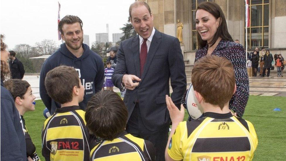 Prince William talking to young rugby players