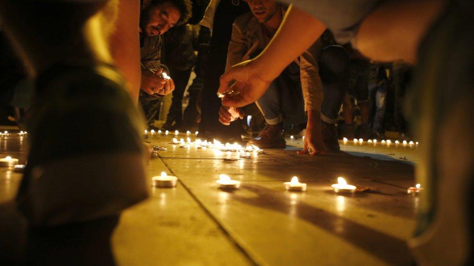 Candles are lit during a night time vigil in Rabat, Morocco - Wednesday 15 June 2016