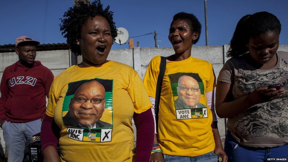 ANC supporters cheer on voters along the streets of Khayelitsha Township on May 7, 2014 in Cape Town, South Africa.