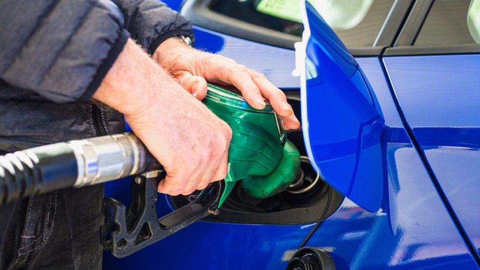 Man filling petrol tank