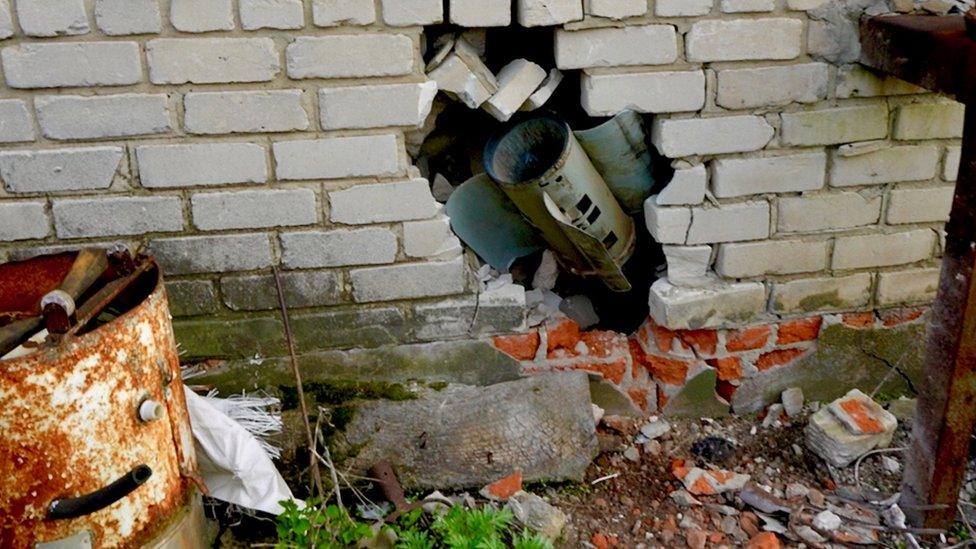 Rocket embedded in a wall