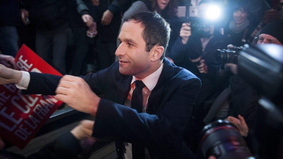 French former Education minister Benoit Hamon (C) arrives for a speech after the results of the first round of the party primaries in Paris, France, 22 January 2017