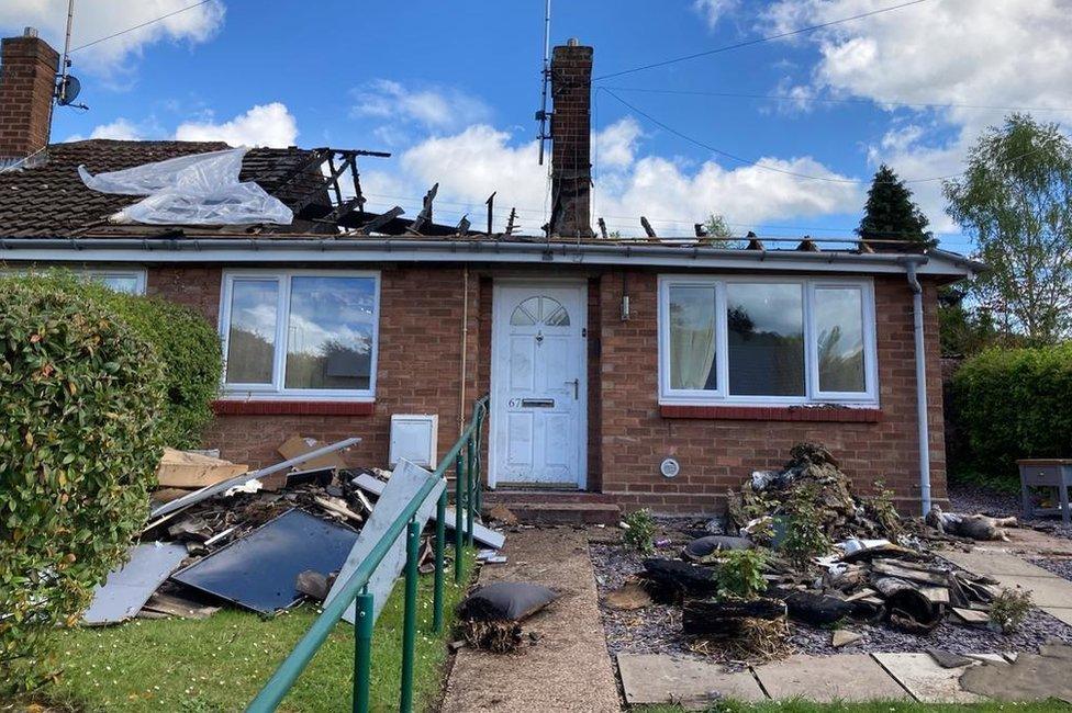 The bungalow after the fire destroyed the roof