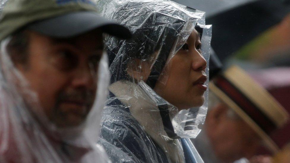 Priscilla Chan in rain gear