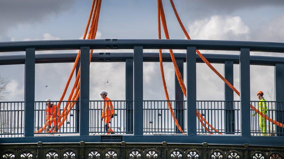 New 11ft wide (3.5m) bridge was hoisted into place by a huge crane on Saturday