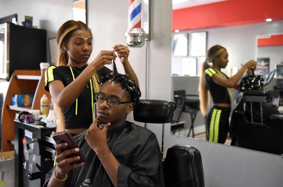 Francina Townes, 18, works as a part-time hairdresser while studying at high school