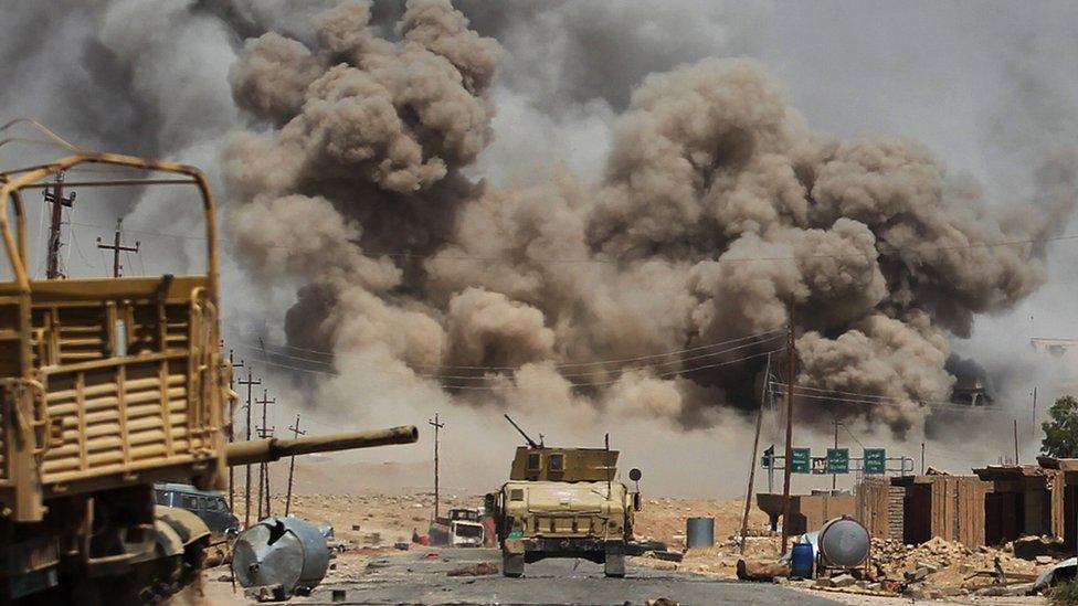 Smoke billows as Iraqi forces advance towards Ayadiya, so-called Islamic State's last remaining active front line near Tal Afar, 29 August 2017