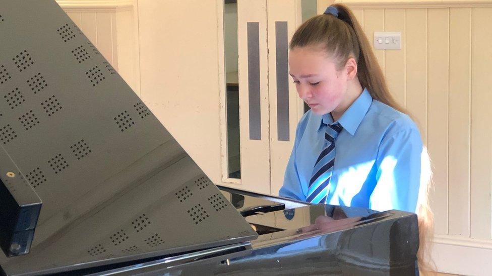 A 12-year-old playing the piano