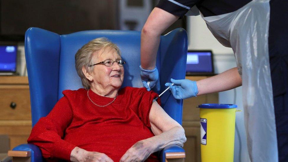 elderly woman given vaccine