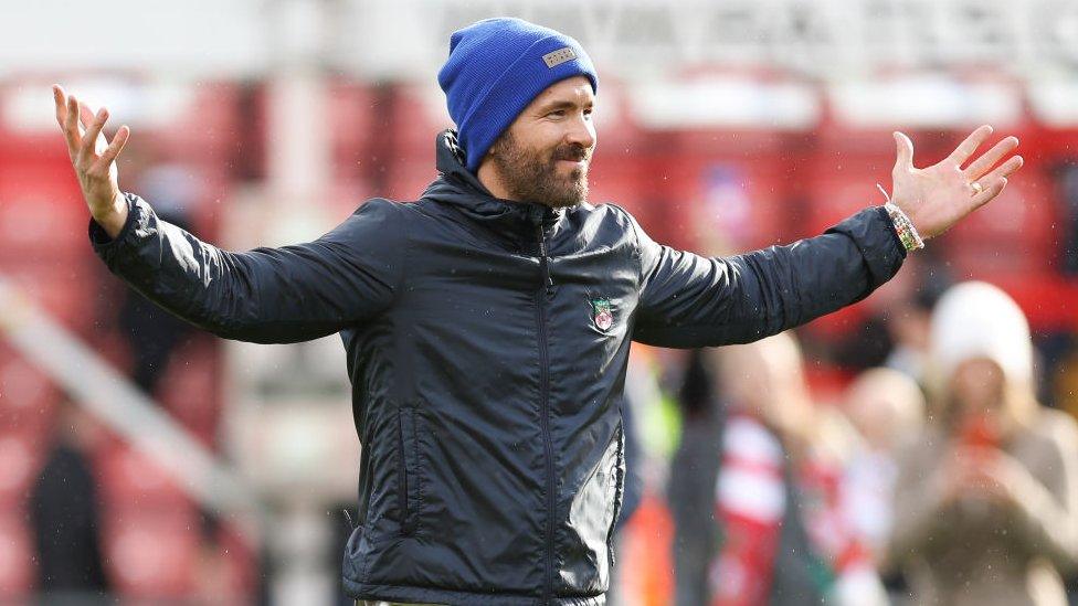 WREXHAM, WALES - APRIL 10: Hollywood actor and co-owner of Wrexham Football Club Ryan Reynolds celebrates his team's 3-2 victory during the Vanarama National League fixture between Wrexham and Notts County at The Racecourse Ground on April 10, 2023 in Wrexham, Wales. (Photo by Matthew Ashton - AMA/Getty Images)