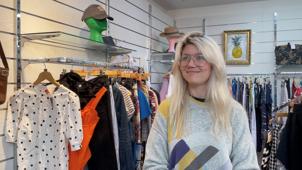 Abi Overland at a clothes shop