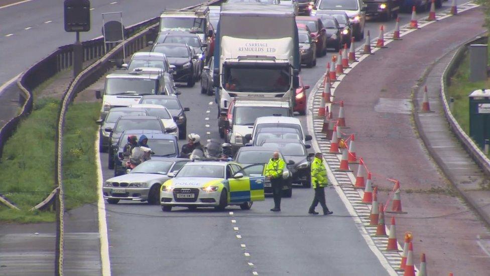 Police at the scene of the fallen cables on the M1