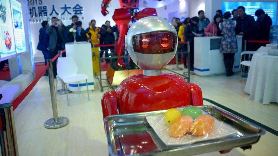 A robot carrying fruits during the World Robot Conference