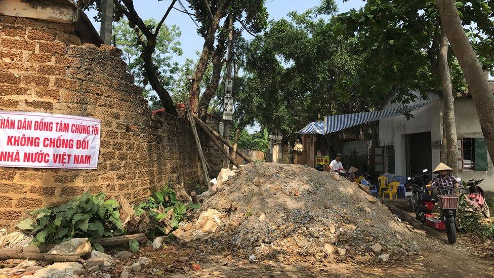 A blocked street in Dong Tam village in 2017