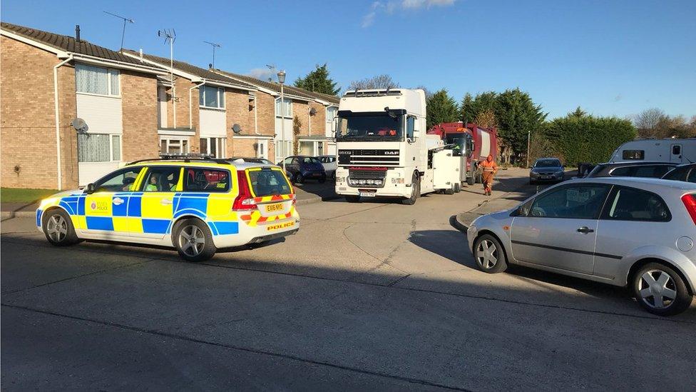 Bin lorry being towed away