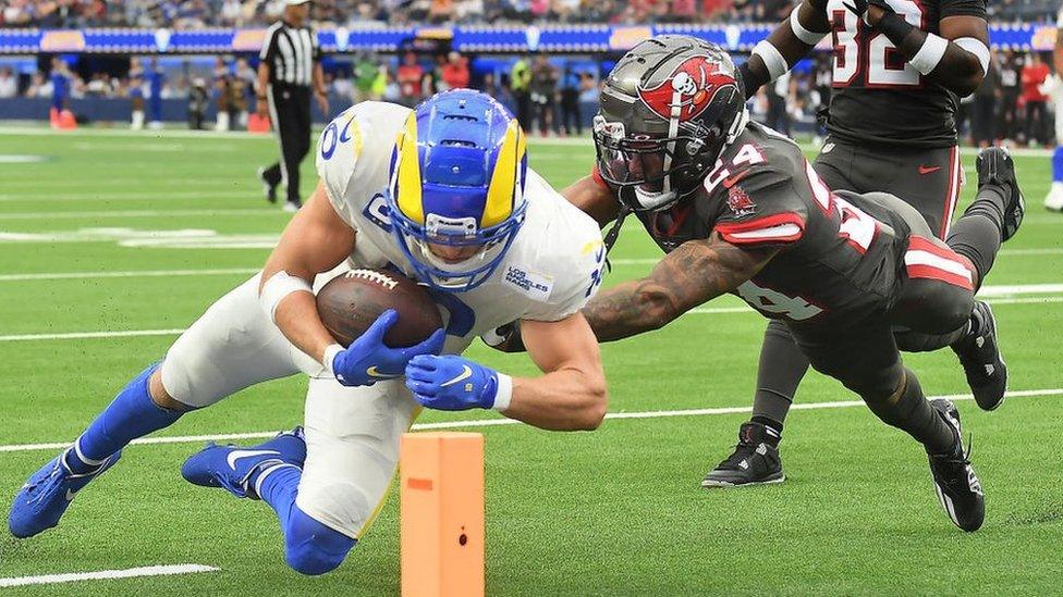 Rams receiver Cooper Kupp dives for the end zone for a touchdown in front of Buccaneers cornerback Carlton Davis in the third quarter at SoFi Stadium in Inglewood Sunday