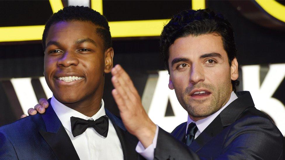 And actors John Boyega, who plays Finn (L) and Poe Dameron actor, Oscar Isaac (R).