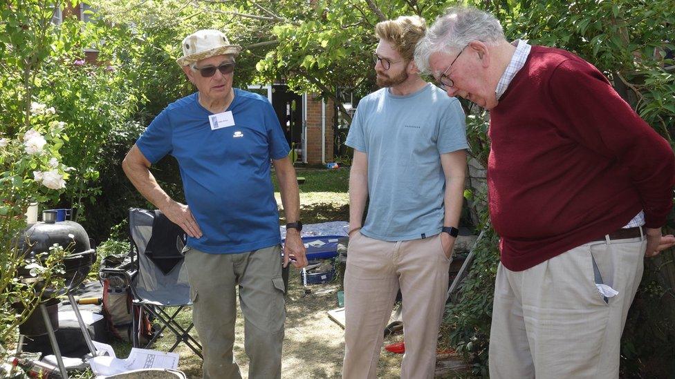 Martin Biddle with supervisor Mike Brace and householder John Tippett-Cooper