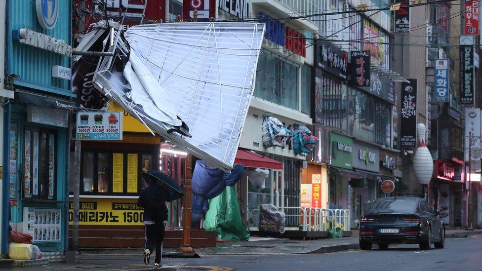 A signboard is seen damaged by Typhoon Hinnamnor in Changwon, South Korea, September 6, 2022.