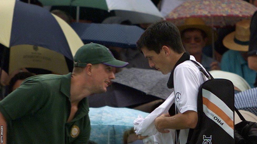 Tim Henman leaves Centre Court mid-semi-final