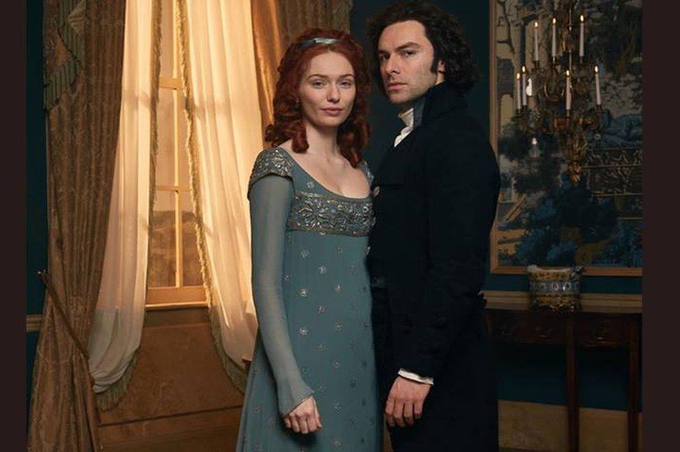 Demelza and Ross Poldark wearing period city fashions